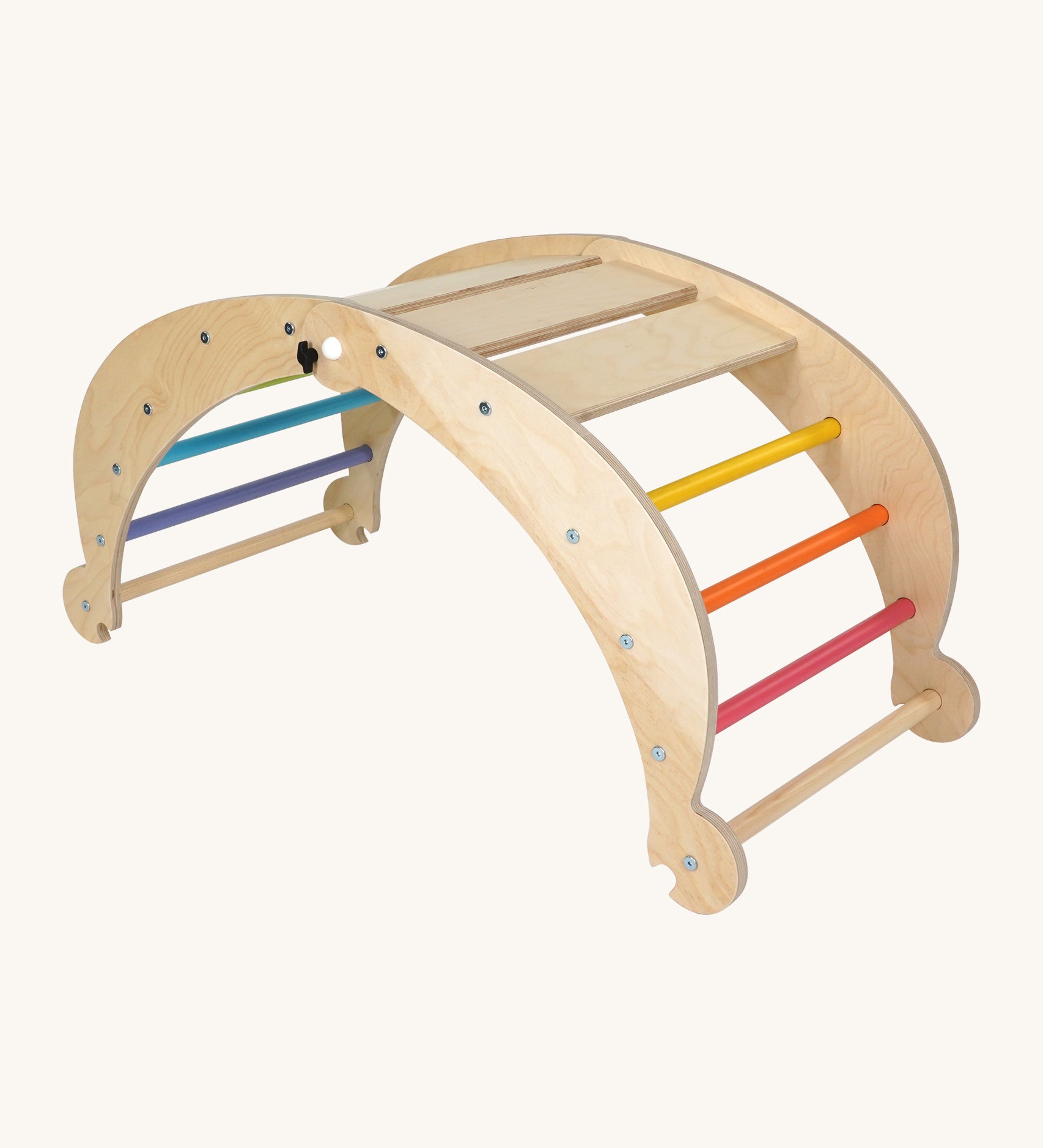 Triclimb wooden folding rocker Archi frame with pastel inspired coloured rungs including pink, orange, yellow, purple blue and green. Features wide wooden slats on top for sitting and attachments on each end to hook onto a Triclimb pikler climbing frame