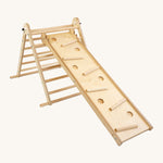 riclimb wooden pikler climbing frame with pastel themed rungs including purple blue, green, yellow, orange and pink. Showing the Triclimb Miri slide hooked on a rung and the sticks in matching pastel colours in the slots on the Miri slide