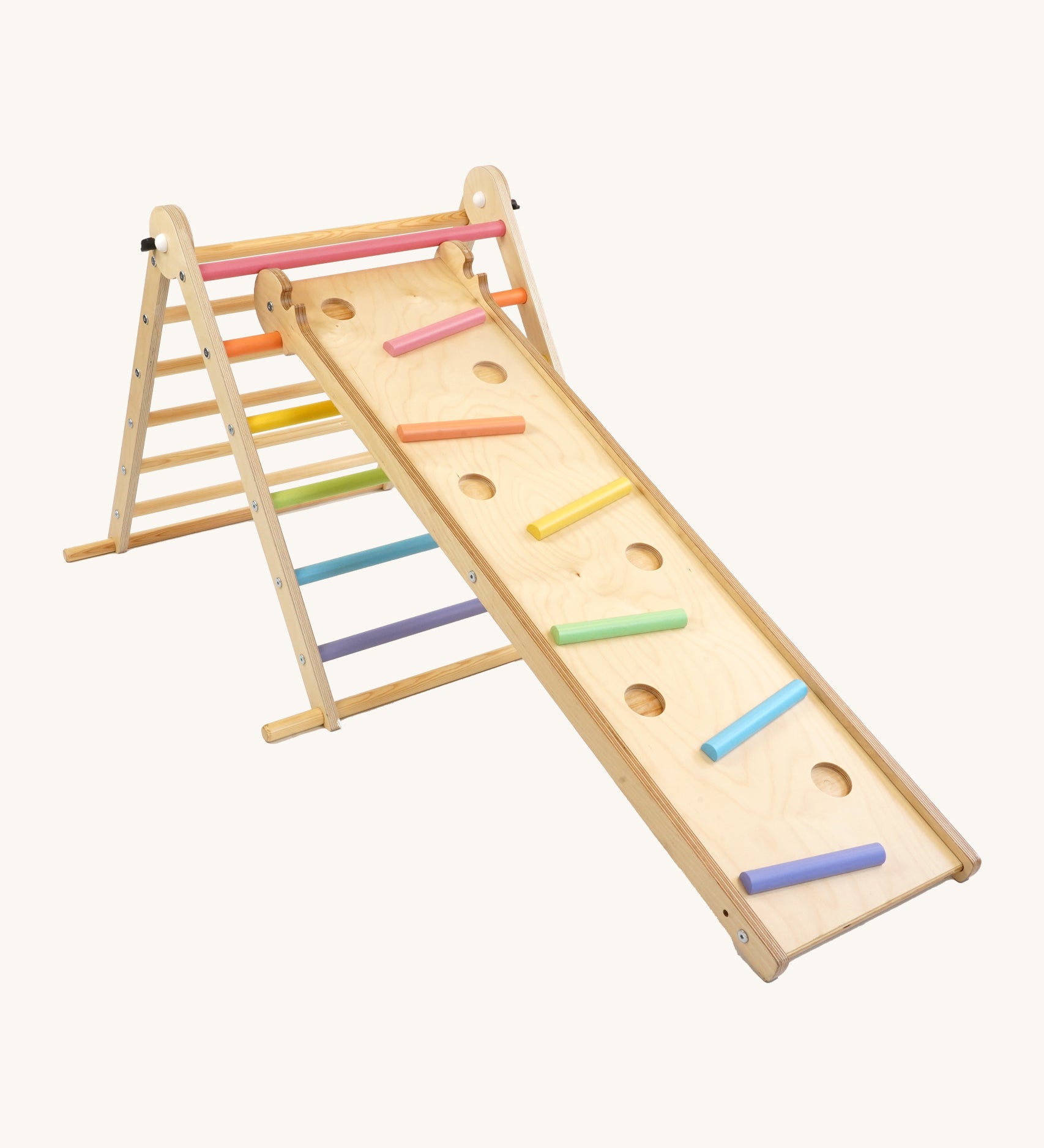 Triclimb wooden folding pikler climbing frame with pastel themed rungs including purple blue, green, yellow, orange and pink. Showing the Triclimb Miri slide hooked on a rung and the sticks in matching pastel colours in the slots on the Miri slide