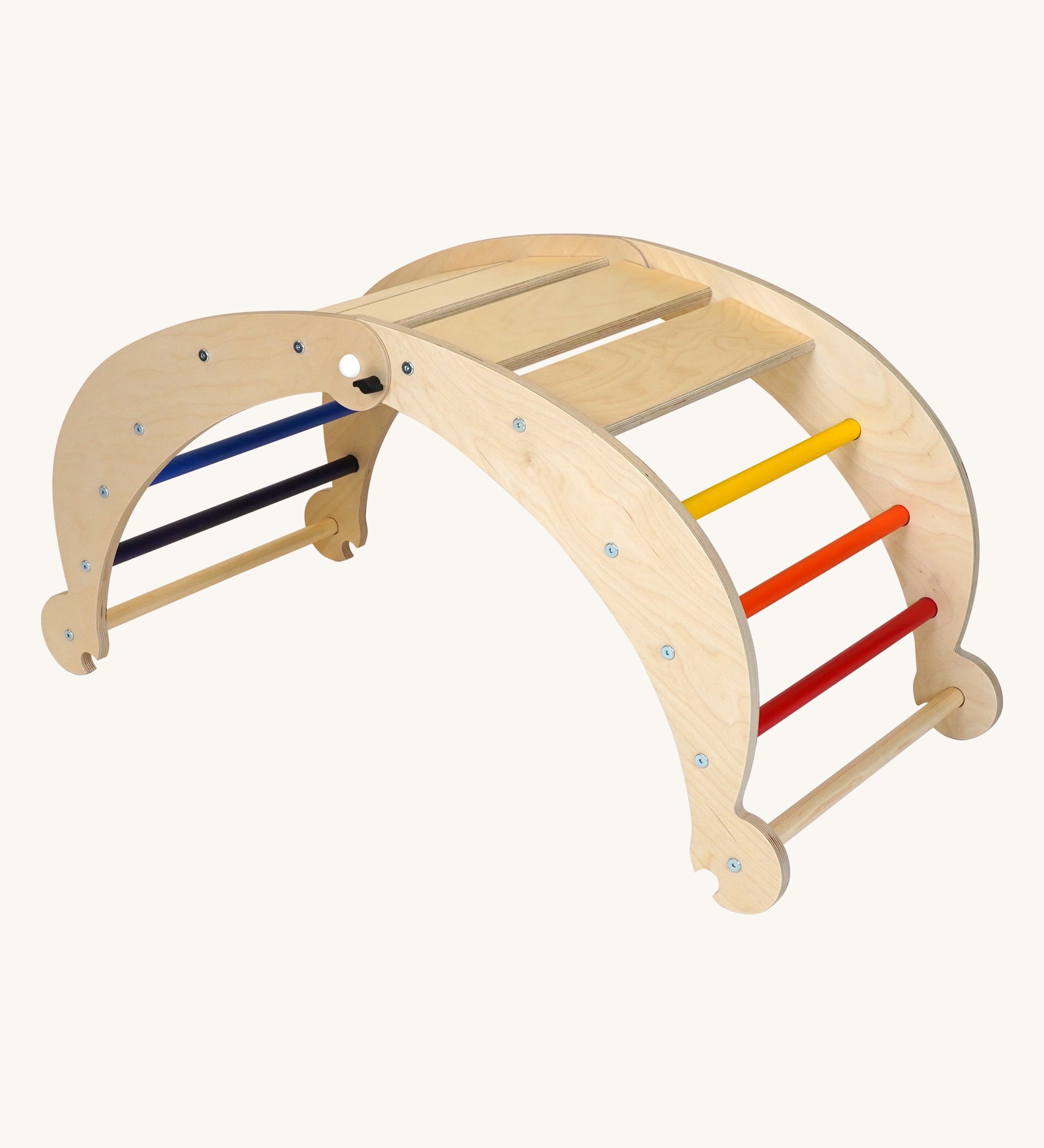 Triclimb wooden folding rocker Archi frame with rainbow coloured rungs including red, orange, yellow, purple blue and green. Features wide wooden slats on top for sitting and attachments on each end to hook onto a Triclimb pikler climbing frame