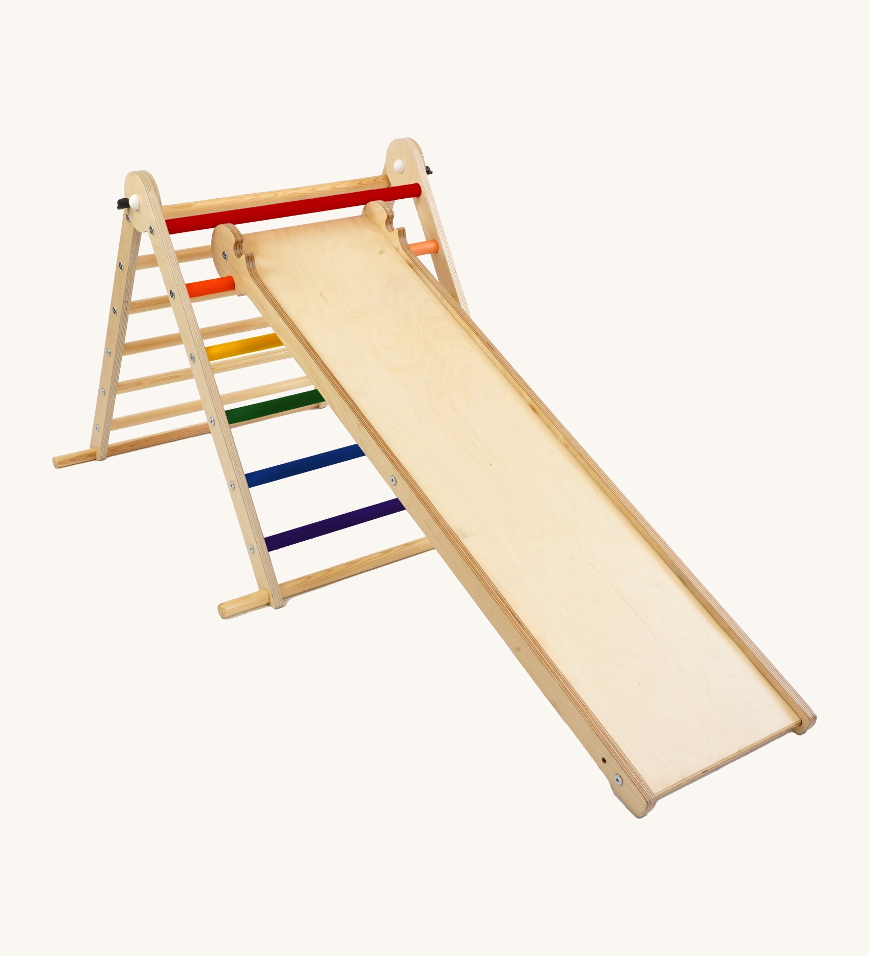 Triclimb wooden folding pikler climbing frame with rainbow themed rungs showing the second side Triclimb Miri slide hooked on a rung.