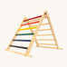 riclimb folding wooden pikler climbing frame with rainbow inspired coloured rungs on one side including purple, blue, green, yellow, orange, red and natural unpainted rungs on the other side. Features longer natural coloured rungs on the bottom as a base. 