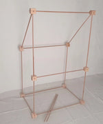 Trigonos big start set showing a market stall construction made up from wooden poles and corner blocks 