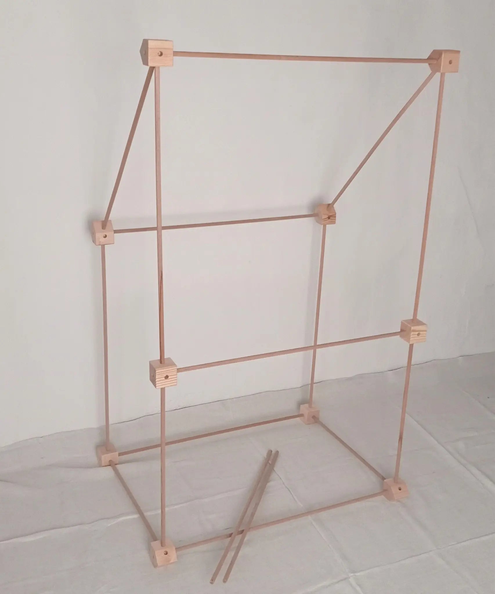 Trigonos big start set showing a market stall construction made up from wooden poles and corner blocks 