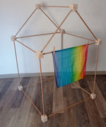 Trigonos wooden big start set made into a tent with a small rainbow cloth hanging on the front