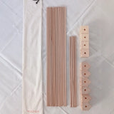 Wooden poles, corner blocks and cotton bag from the Trigonos big start set