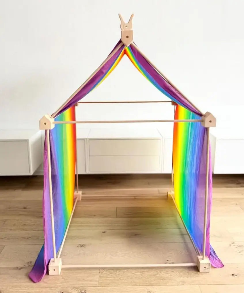 Trigonos big start set with a rainbow cloth showing a tent made up from wooden poles and corner blocks