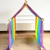 Trigonos big start set with a rainbow cloth showing a tent made up from wooden poles and corner blocks