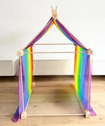 Trigonos big start set with a rainbow cloth showing a tent made up from wooden poles and corner blocks