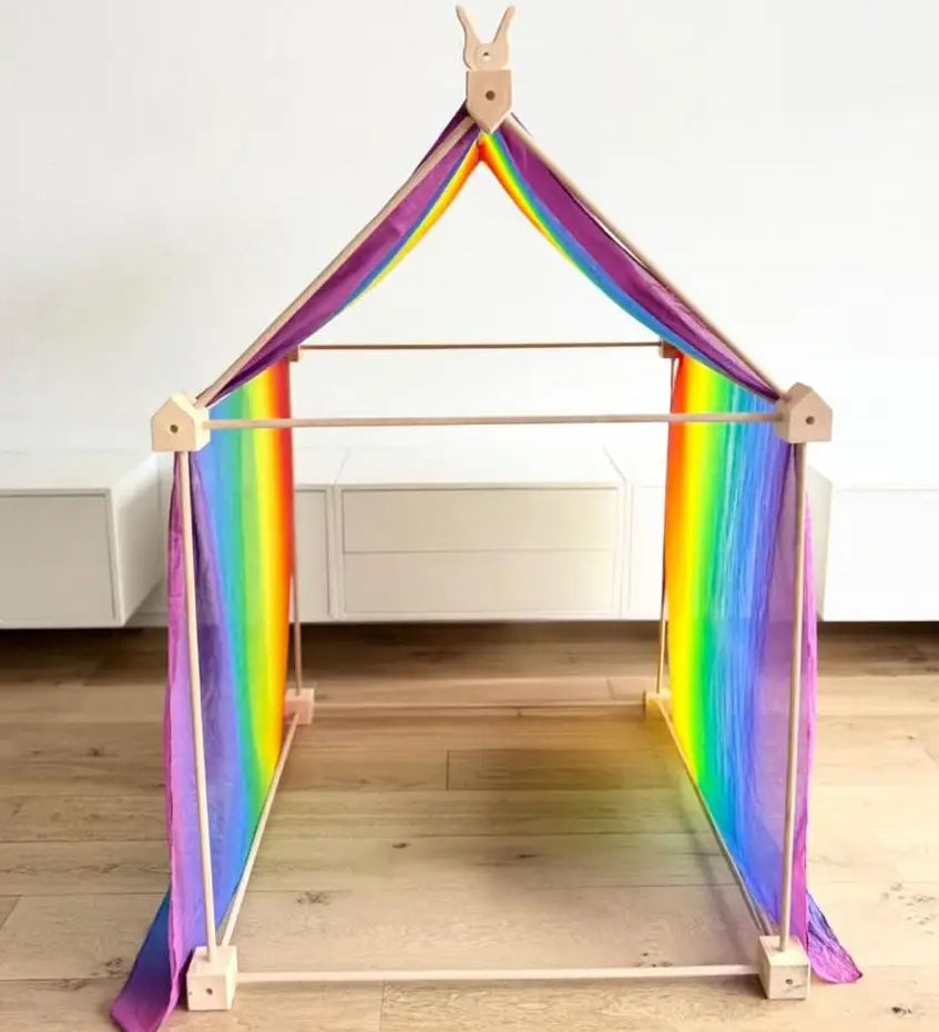 Trigonos big start set with a rainbow cloth showing a tent made up from wooden poles and corner blocks