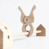 Giant wooden peg clamped around a Trigonos wooden frame pole