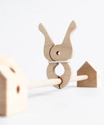 Giant wooden peg clamped around a Trigonos wooden frame pole