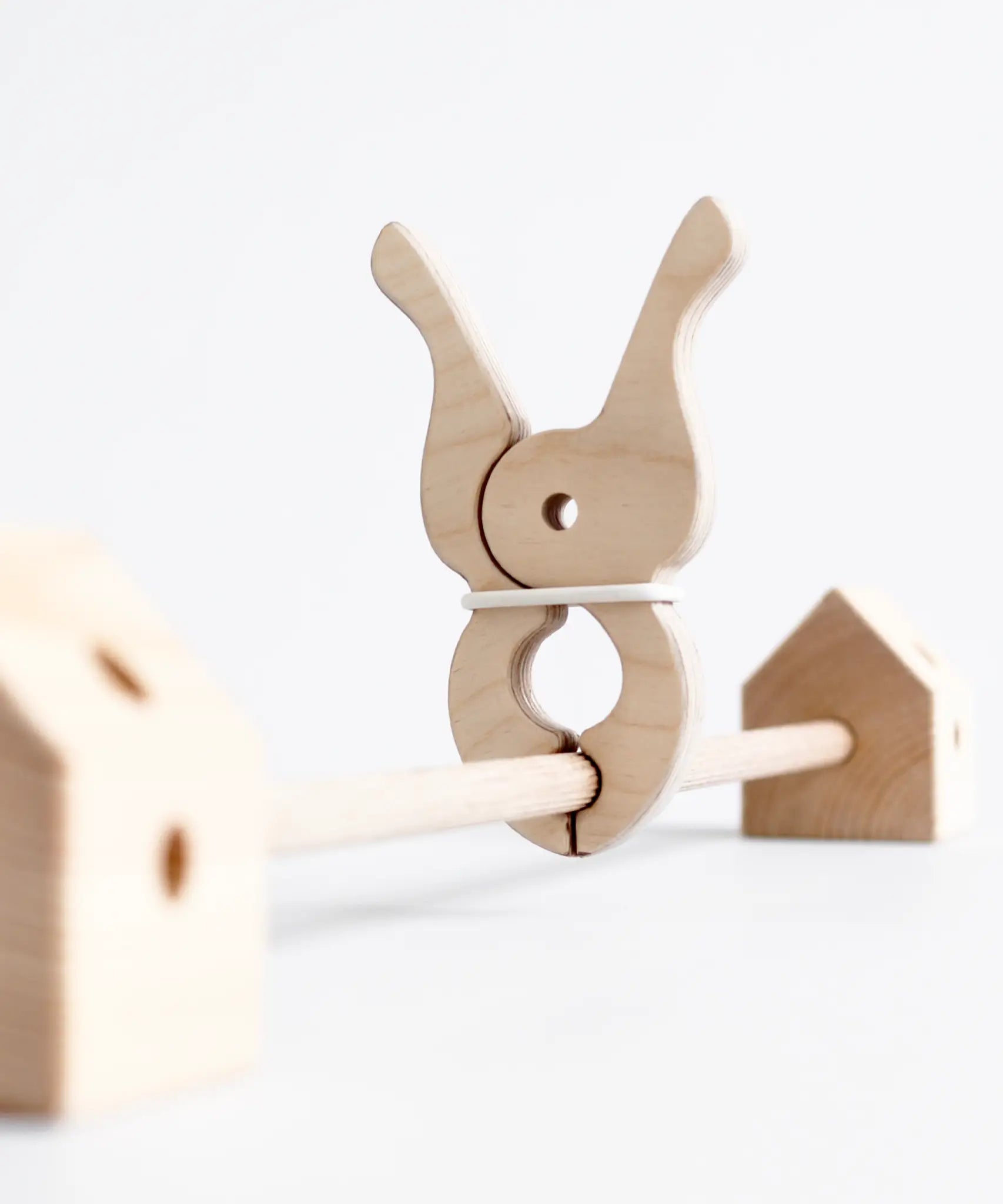 Giant wooden peg clamped around a Trigonos wooden frame pole