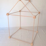 Trigonos big start set showing a tent made up from wooden poles and corner blocks 