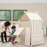 Mother and child standing next to a tent made from the Trigonos family organic wooden construction set 