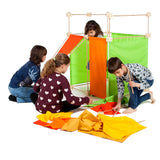 Children building a den made from wooden poles, blocks and coloured sheets from Trigonos maxi construction set