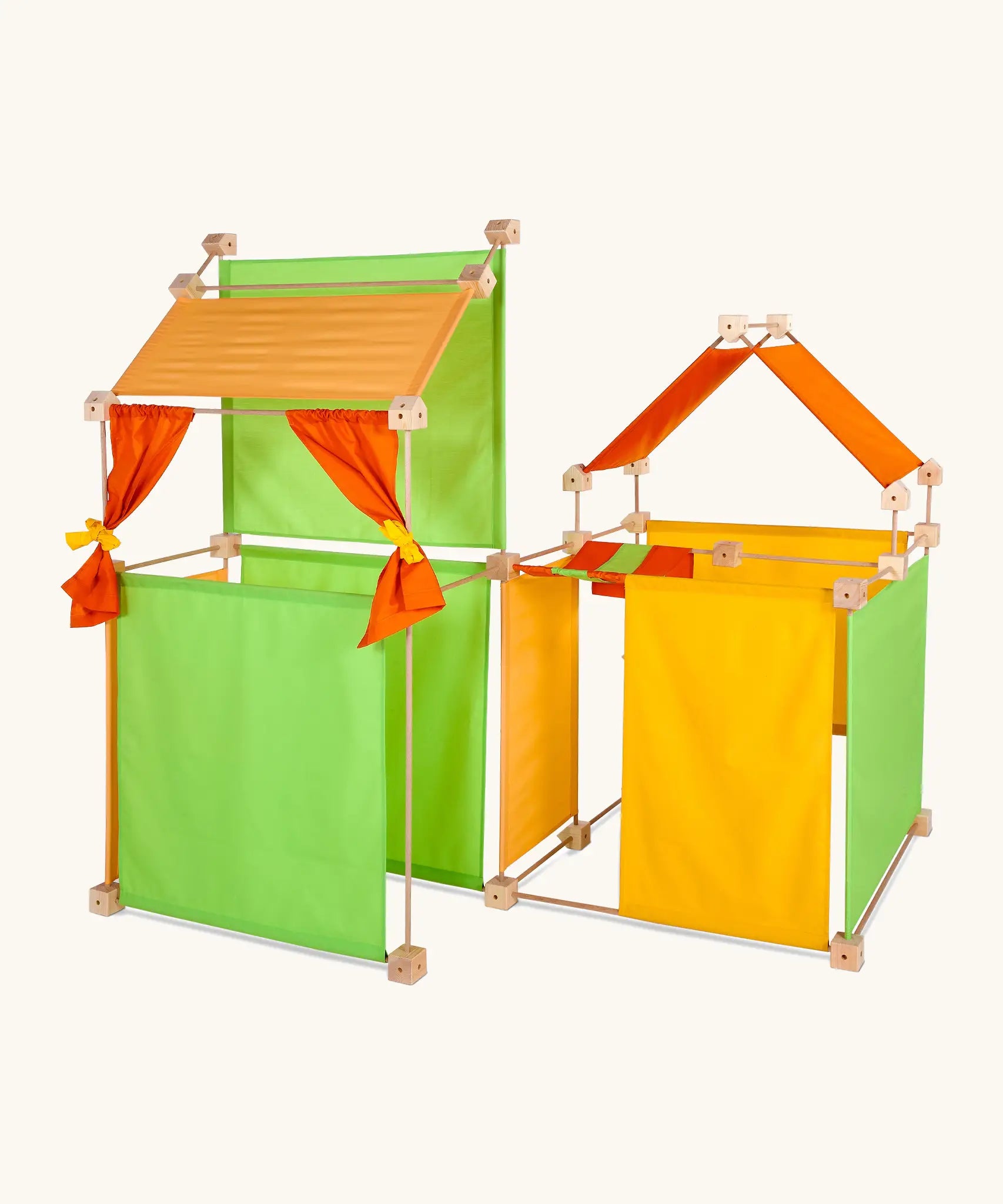 Trigonos maxi green construction set showing a den made from wooden poles, blocks and coloured cotton sheets 