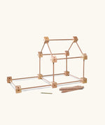 A simple structure using the Trigonos starter set pieces showing different wooden poles and corner pieces