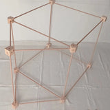 Trigonos big start set showing a tent build on its side made up from wooden poles and corner blocks 