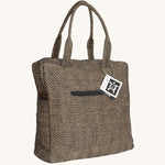 The Turtle Bags jute laptop duffle bag, in a black woven design with zig zags