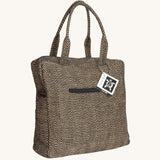 The Turtle Bags jute laptop duffle bag, in a black woven design with zig zags