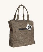 The Turtle Bags jute laptop duffle bag, in a black woven design with zig zags
