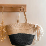 Turtle Bags black block colour jute basket hanging on a wooden coat hanger