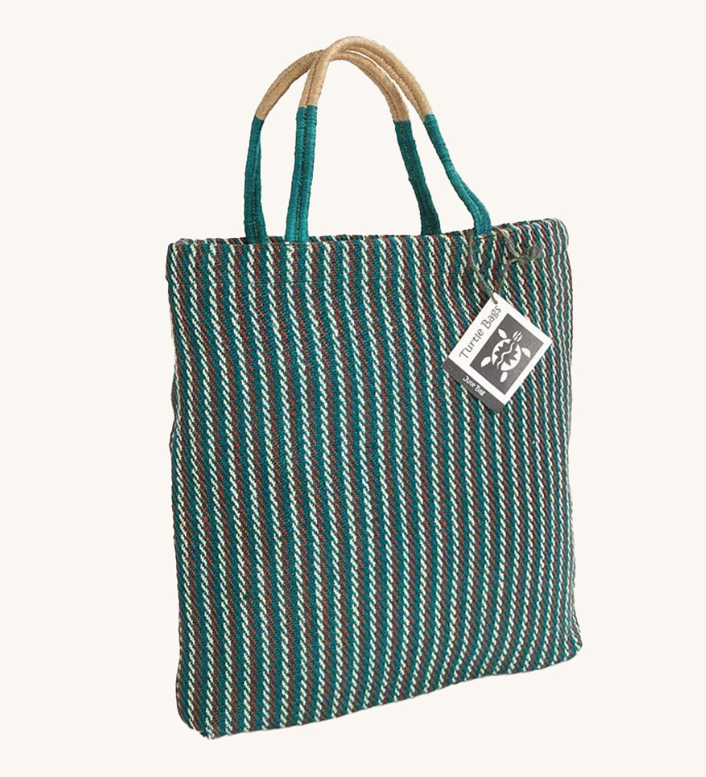 The Turtle Bags hand woven jute tote bag, in a teal stripe design with medium length handles