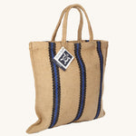 The Turtle Bags hand woven jute tote bag in a blue and black stripe design