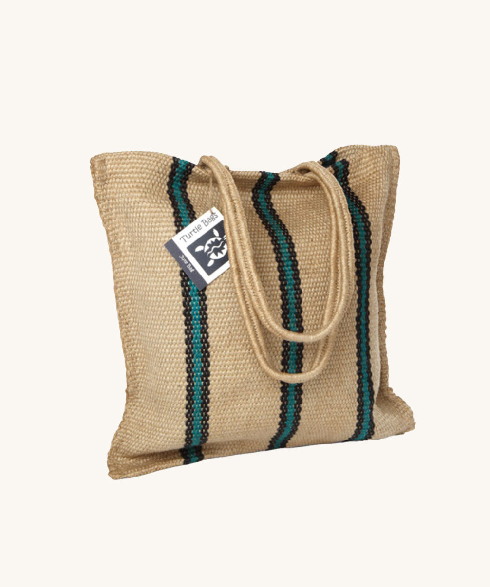 The Turtle Bags hand woven stripey jute tote shopping bag in a green stripe design with a long handle