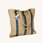 The Turtle Bags hand woven stripey jute tote shopping bag in a green stripe design with a long handle