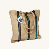 The Turtle Bags hand woven stripey jute tote shopping bag in a green stripe design with a long handle