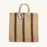 The Turtle Bags hand woven jute tote bag in a red and black stripe design