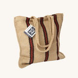 The Turtle Bags hand woven stripey jute tote shopping bag in a red stripe design with a long handle