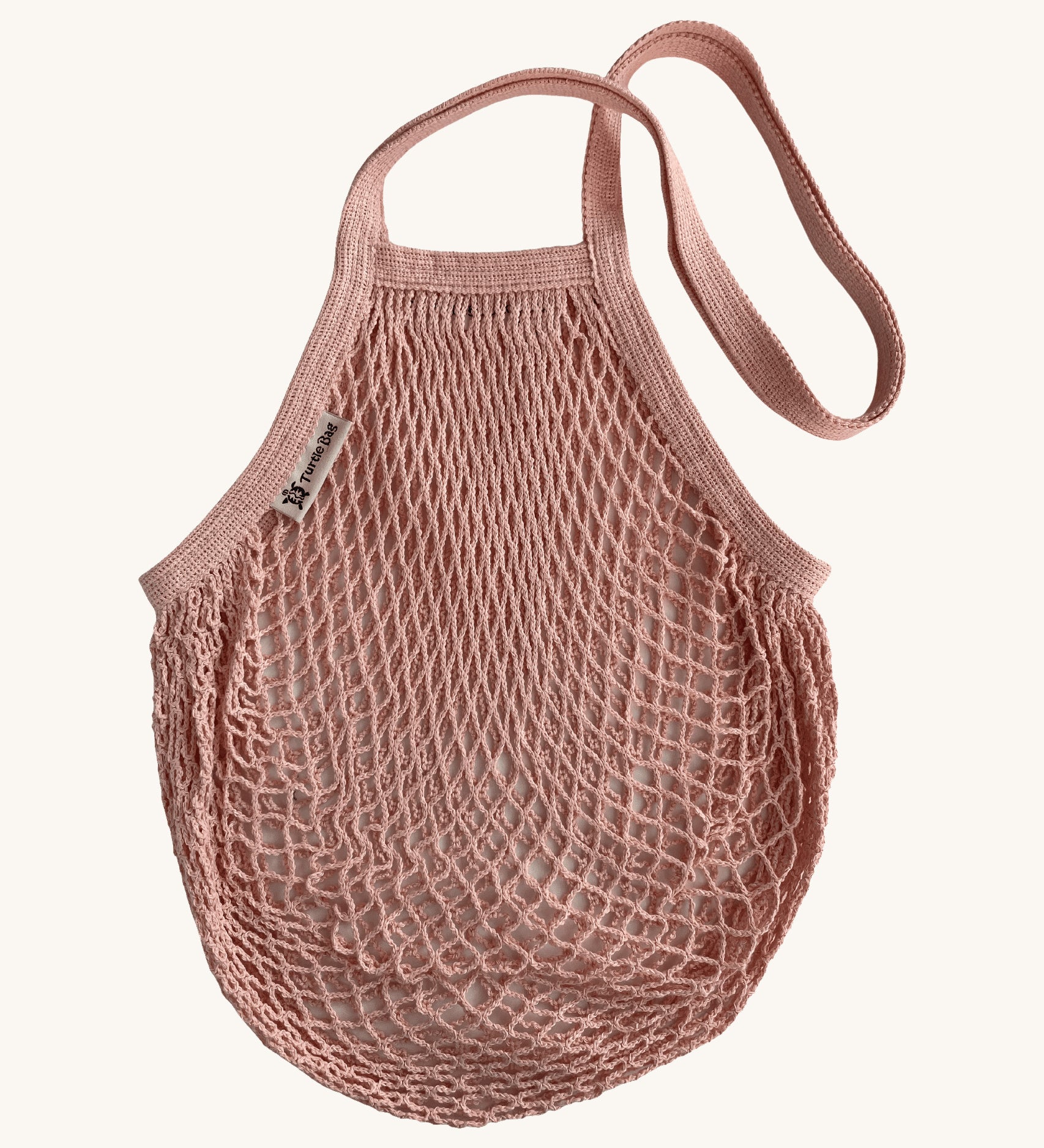 The Turtle Bags organic and fair trade cotton string bag for grocery shopping - in a blush pink colour