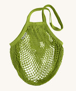 The Turtle Bags organic and fair trade cotton string bag for grocery shopping - in a lime green colour