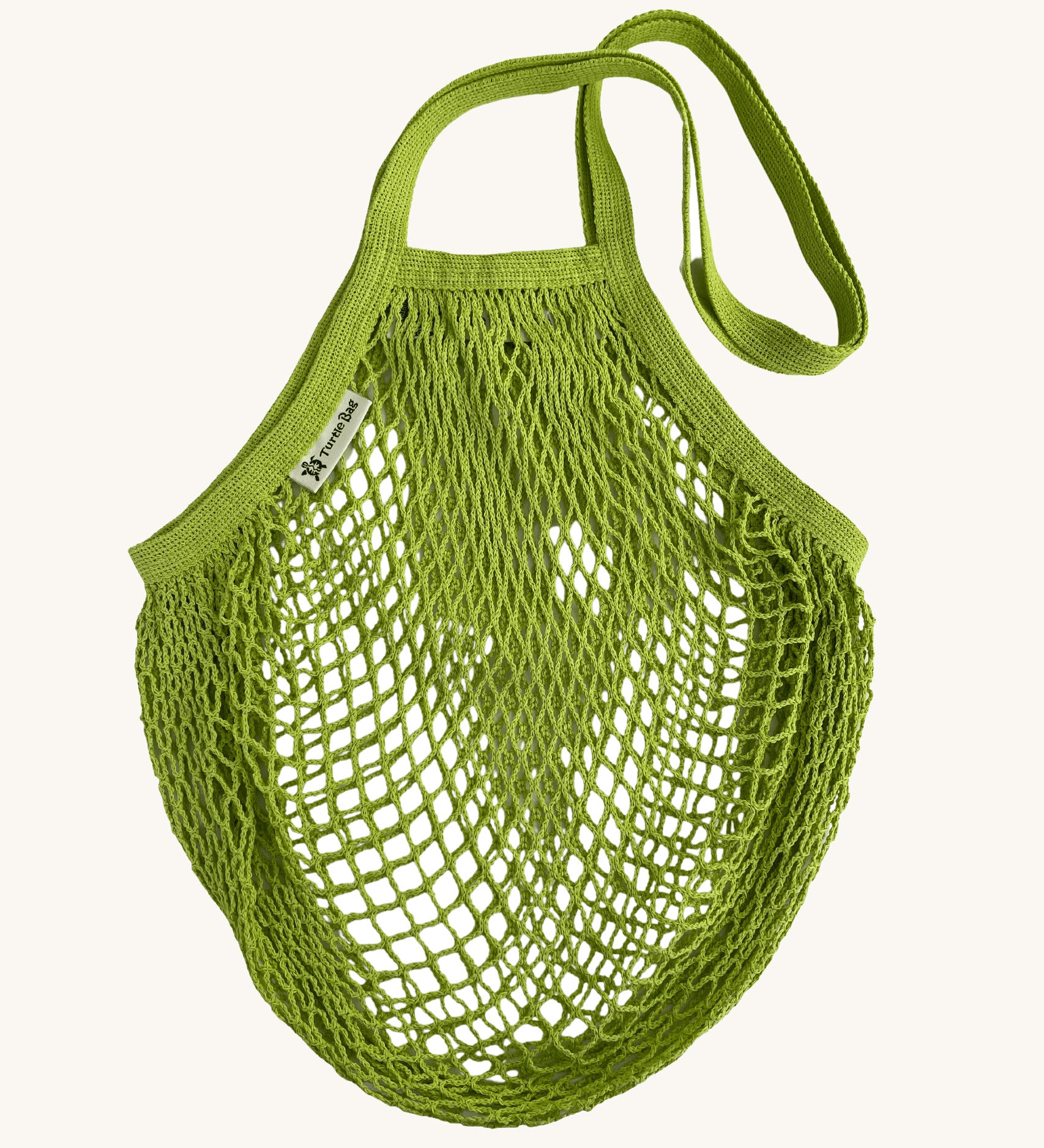The Turtle Bags organic and fair trade cotton string bag for grocery shopping - in a lime green colour