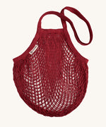 The Turtle Bags organic and fair trade cotton string bag for grocery shopping - in a vegetable dyed botanic rust red colour