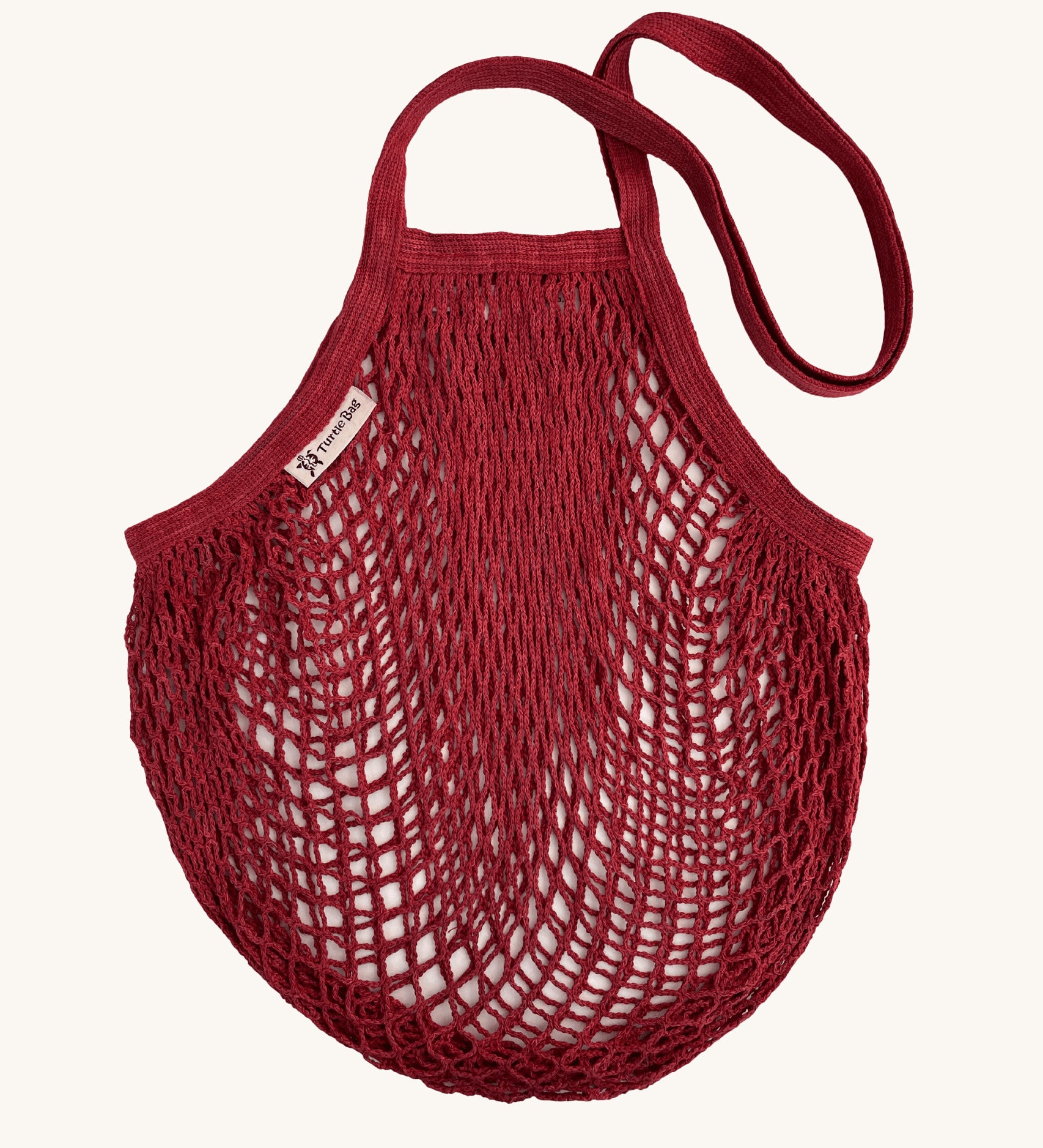 The Turtle Bags organic and fair trade cotton string bag for grocery shopping - in a vegetable dyed botanic rust red colour