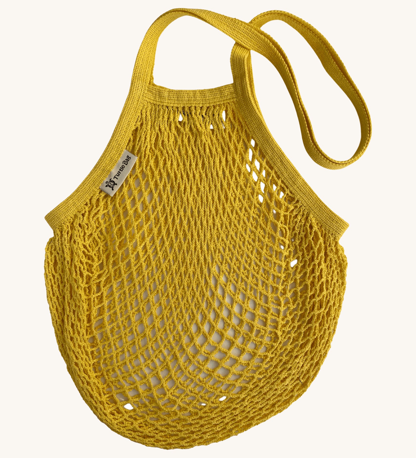 The Turtle Bags organic and fair trade cotton string bag for grocery shopping - in a sunflower yellow colour
