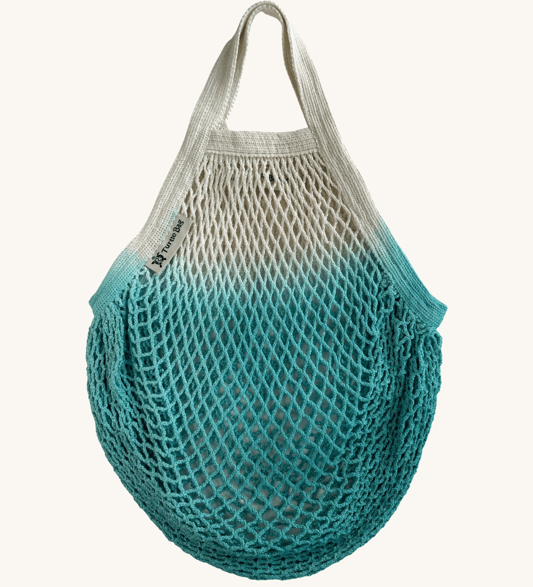 The Turtle Bags organic, fair trade cotton string grocery shopping reusable bag in dip dye turquoise