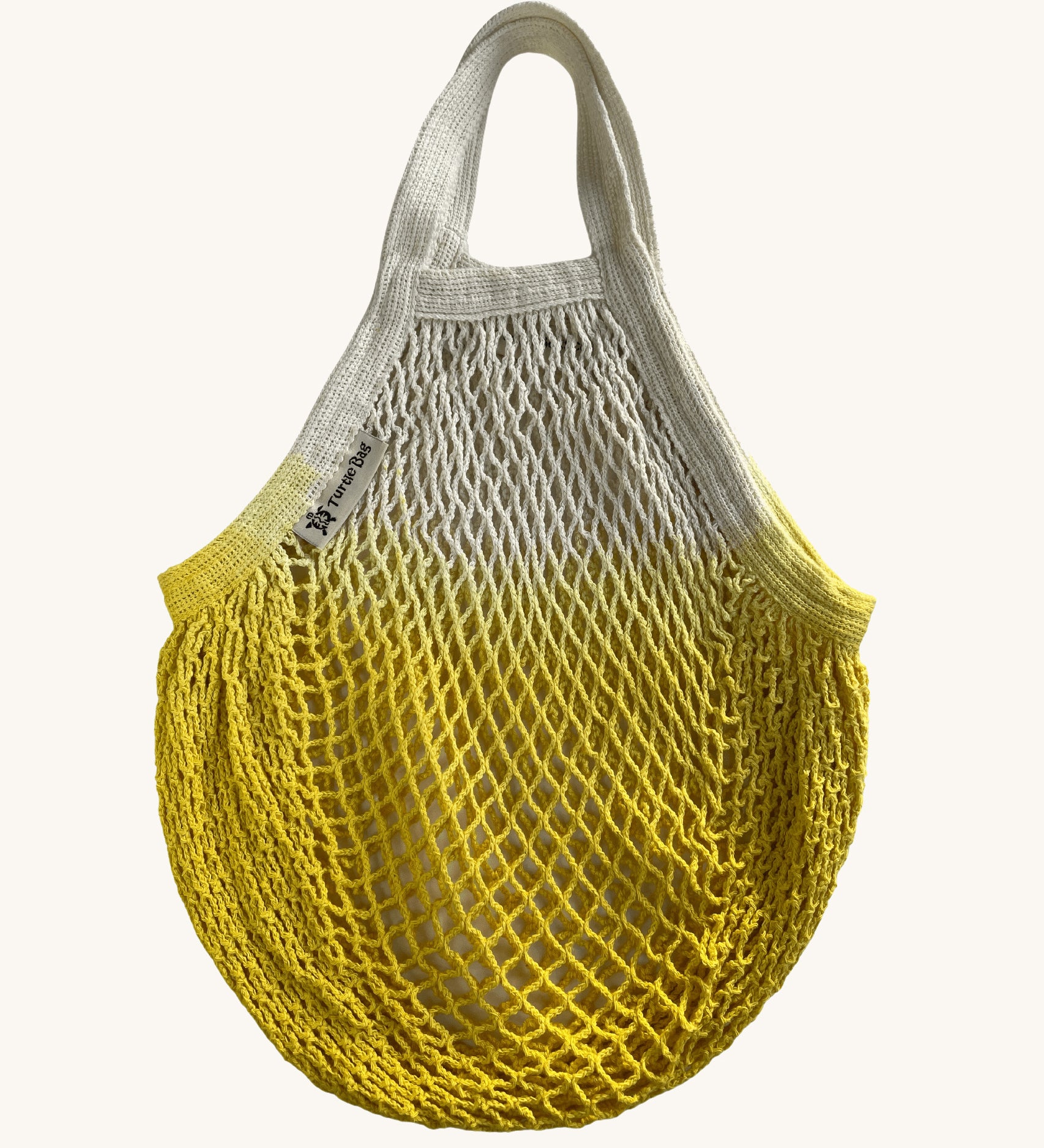 The Turtle Bags organic, fair trade cotton string grocery shopping reusable bag in dip dye yellow