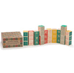 Uncle Goose plastic free Chinese toy blocks stacked in a curvy pile on a white background next to their cardboard box