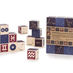 Uncle Goose plastic free wooden constellation toy cubes stacked on a white background next to their box