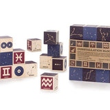 Uncle Goose plastic free wooden constellation toy cubes stacked on a white background next to their box