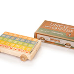 Uncle goose plastic free wooden toy wagon next to its box on a white background