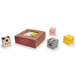 Uncle goose eco-friendly wooden farm cubelings blocks scattered on a white background next to their cardboard box
