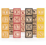 Uncle Goose wooden German language blocks stacked in 7 piles on a white background