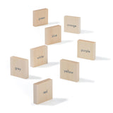 Uncle Goose kids wooden English language learning blocks scattered on a white background
