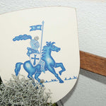 The shield from the Vah Albert Blue Mini Wooden Shield & Sword Set